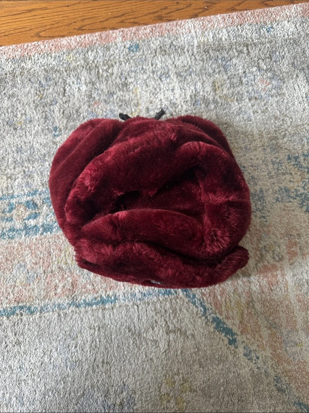 Plush Faux Fur Hat in Deep Burgundy with Decorative Medallion